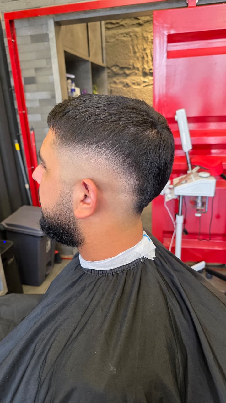 Sharp fade haircut with beard finish